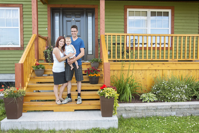 Family in front of home